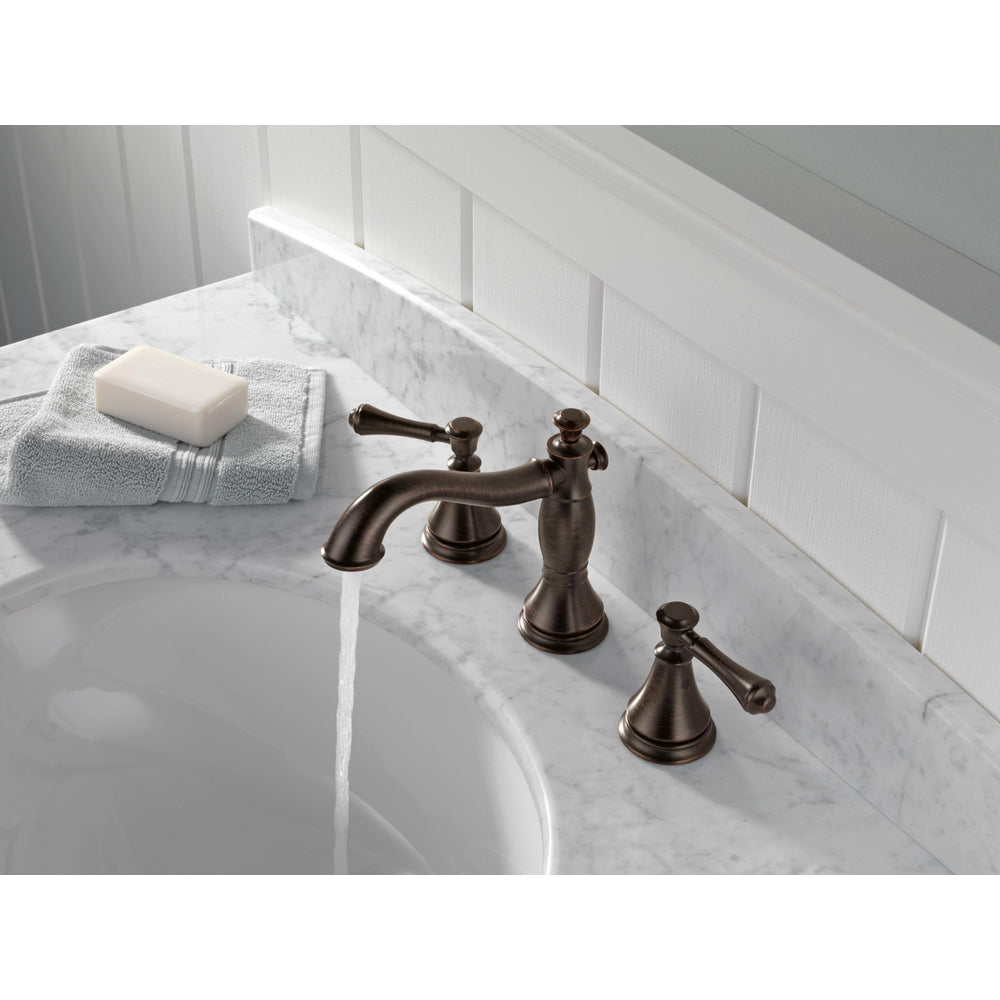 Delta Robinet de salle de bains espacé à deux poignées CASSIDY avec robinet escamotable en métal - Bronze vénitien
